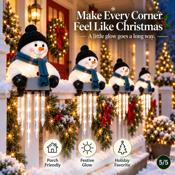 Lighted snowman Christmas decoration with cascading icicle lights on a porch railing